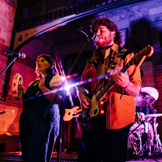 Musician Ricky Albeck and band performing on stage